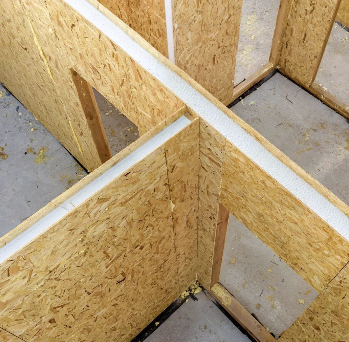 SIP wall panels meeting at interior and exterior wall intersections
